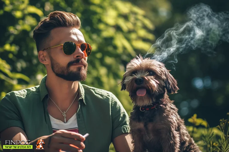 גבר מעשן סיגריה ליד כלב